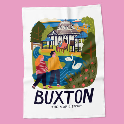 Tea towel with illustration of Buxton, The Peak District on a pink background