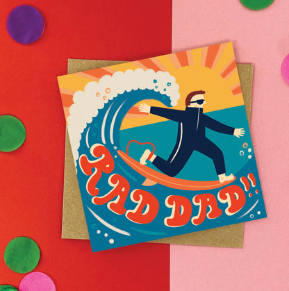 Greeting card with a surfer design and 'RAD DAD!' text on a colorful background