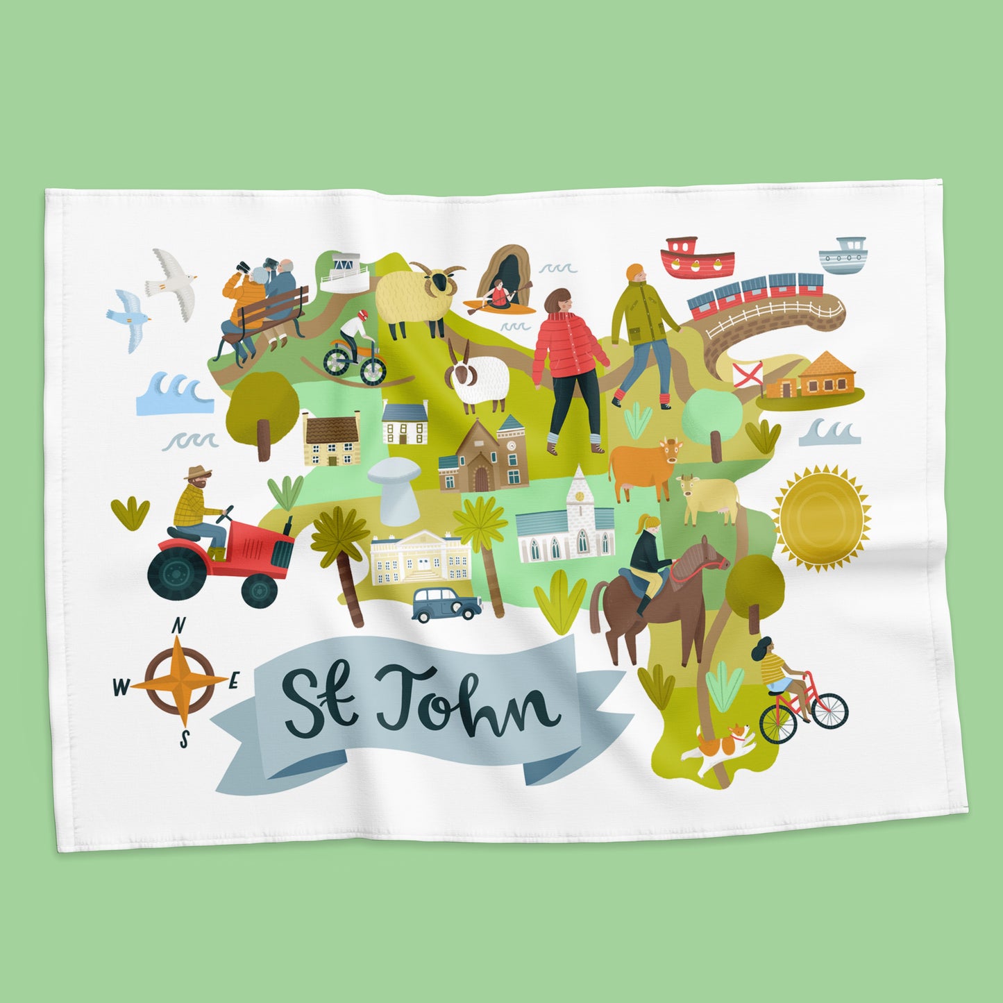 Colorful map of St. John with various activities on a white towel against a green background